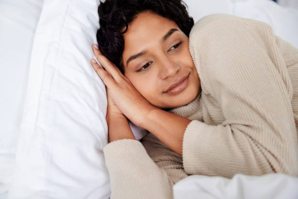 istock Contemplation: Woman Resting in Bed 1665148903