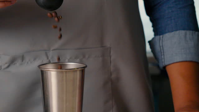 barista coffee beans weighing slow motion video.