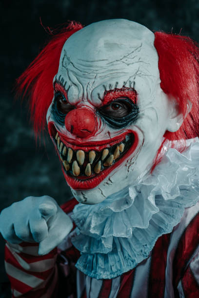 istock mad evil redhead clown pointing to the observer 1665157524