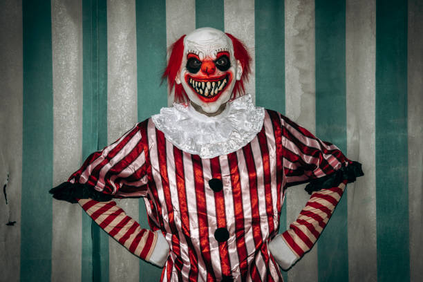 istock mad evil redhead clown with his arms on his hips 1665158109