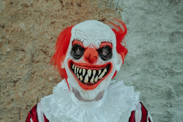 istock evil redhead clown in front of a rustic house 1665160205