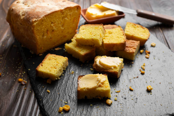 istock Homemade cornbread slices and butter on kitchen table 1665163068