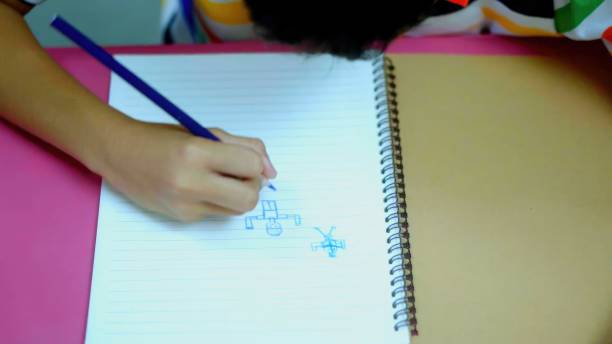 istock Asian Kids in Creative coloring book Art workshop at school. 1665186295