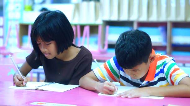 istock Asian Kids in Creative  coloring book Art workshop at school. 1665186838
