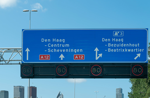 Blue traffic direction signs on the A12 motorway in The Hague, Holland