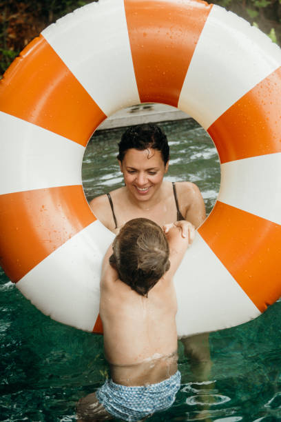 Mother and son enjoying the pool