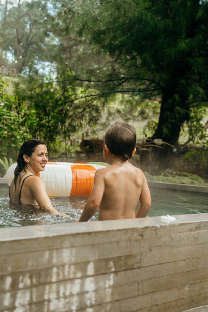 istock Mother and son enjoying the pool 1665213314