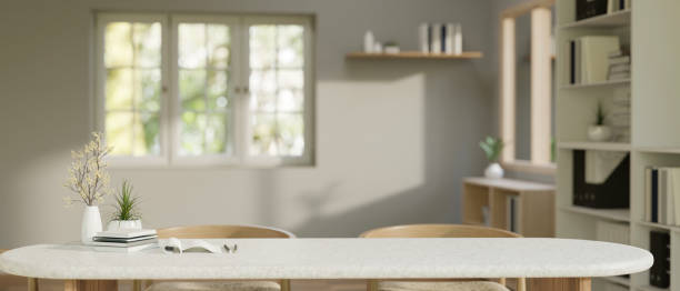 istock Copy space on a white tabletop in a modern minimalist living room. close-up image. 1665216579