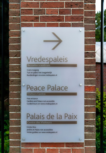 The Hague, Holland-July 26 2023: The sign about the visit of Peace Palace building at the entrance.