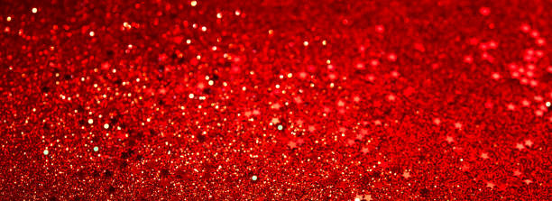 istock Red glitter confetti abstract red background, luxury Christmas backdrop with red stars. Brilliant colored sequins. Holiday greeting card. 1665223872