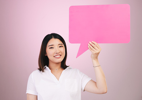 Speech bubble isolated on pink pastel color background with shadows minimal conceptual 3D rendering