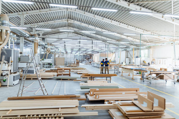 istock Engineers discussing ongoing project in modern hall in factory. Both employees wearing protective equipment 1665231571