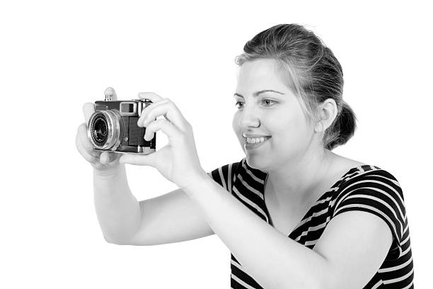 istock Retro monochrome pretty woman photographer 166523402