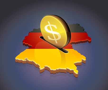 3D map of Germany in the colors of the German flag in which a gold coin with the dollar symbol on a dark background