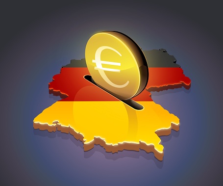 3D map of Germany in the colors of the German flag in which a gold coin with the euro symbol on a dark background