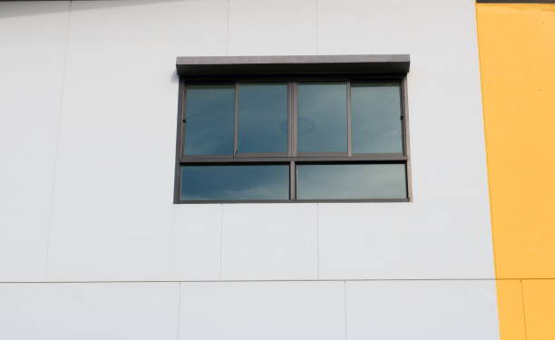 istock Glass windows with window tint film and reflect sky on surface. 1665336013