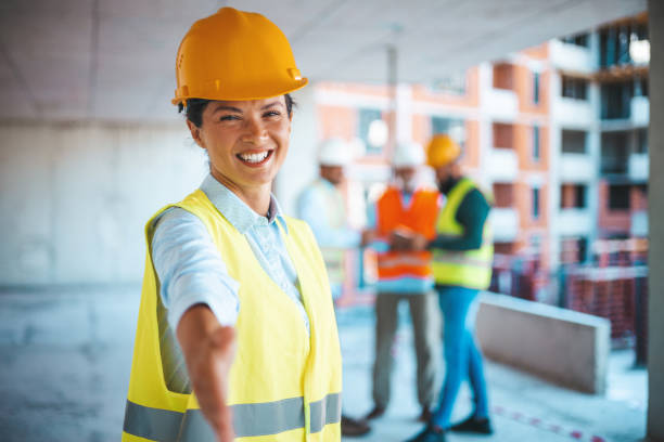 istock A female architect is standing and shaking hands. 1665339045
