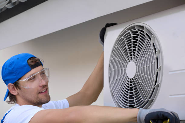 istock Experienced service employee smiles when installing outdoor air conditioning 1665341938