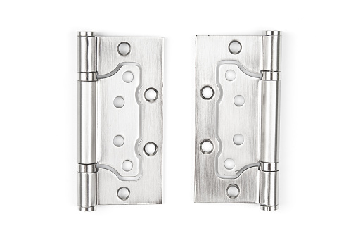 Metal door hinges close up on a white background