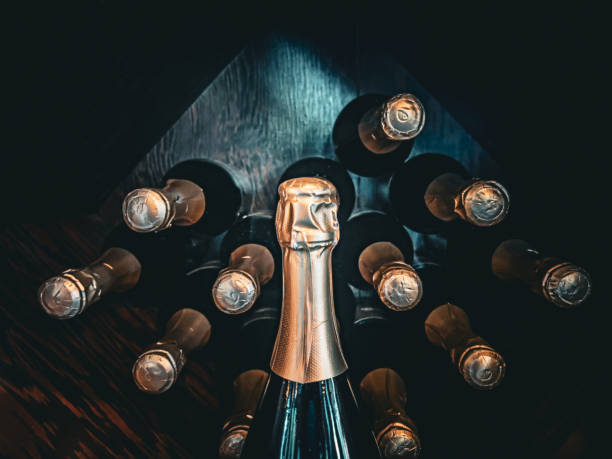istock Gold Foiled Champagne Bottle Tops Stored in a Wine Cellar 1665369677