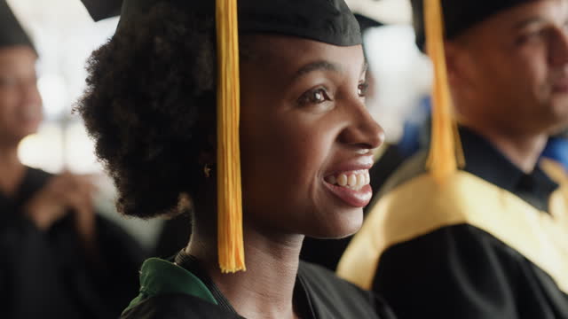 Graduation, ceremony and smile of black woman at event in college, university or school. African graduate, happy student and audience in celebration of achievement in education, learning and success