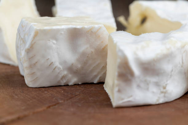 istock delicious white cheese sliced on a board 1665371332