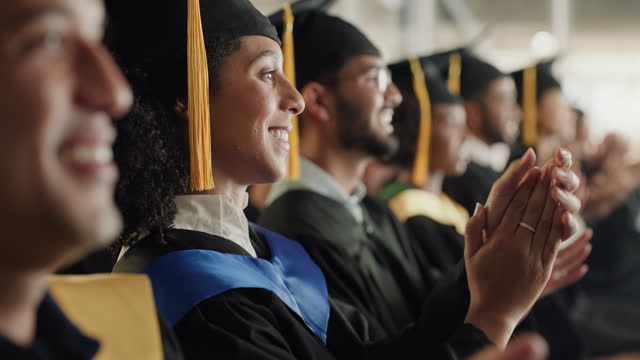 Graduation, education or applause with business students at a ceremony for the celebration of an achievement. Support, motivation or success with a group of people clapping in a crowd at university