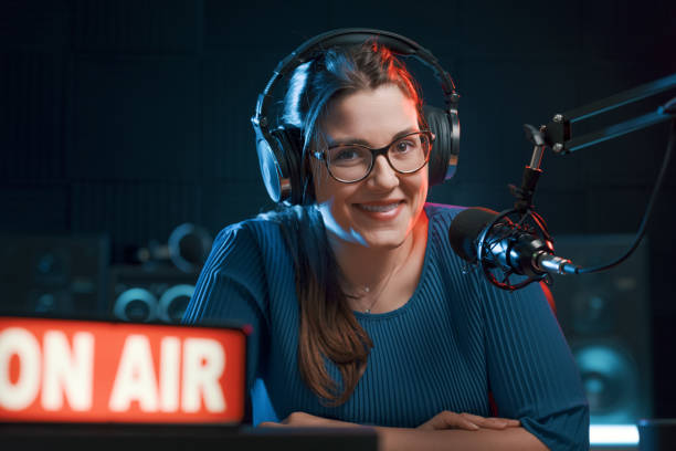 istock Female radio host in the studio portrait 1665387899
