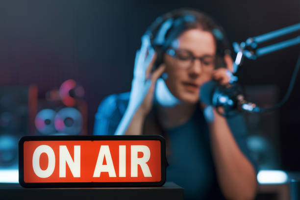 istock Presenter working at the radio station 1665389003