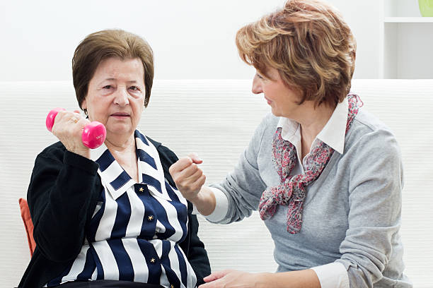 istock Mature lady being shown physical therapy 166540568