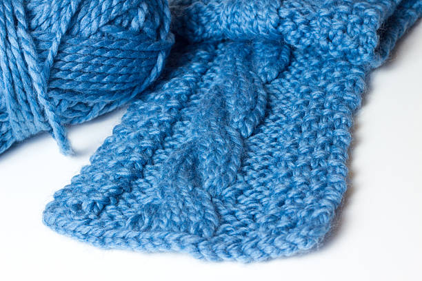 istock Handmade cable knit scarf and yarn 166540914