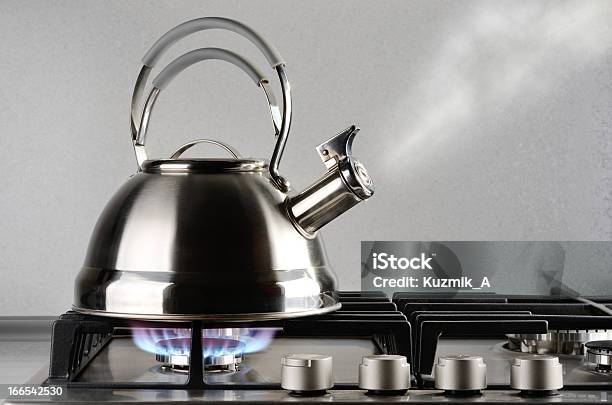 Silver Metal Tea Kettle Blowing Steam As Reaches Boiling Stock Photo - Download Image Now