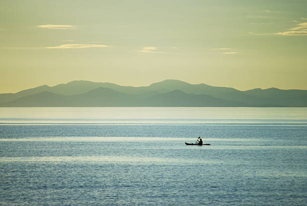 istock Kayaker at dusk, South Island in background 166547307