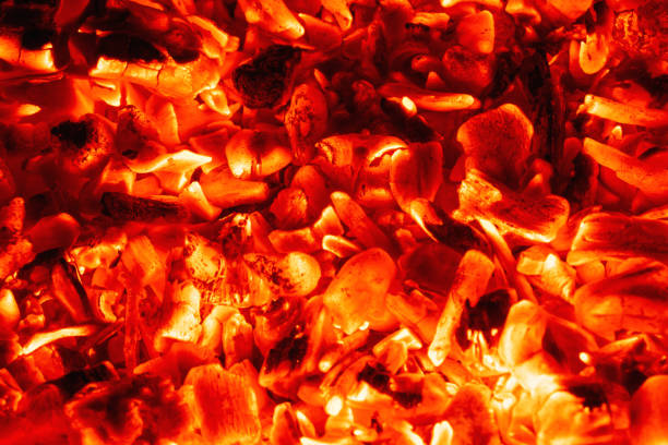istock Smoldering charcoal in a bonfire, background texture 1665480438