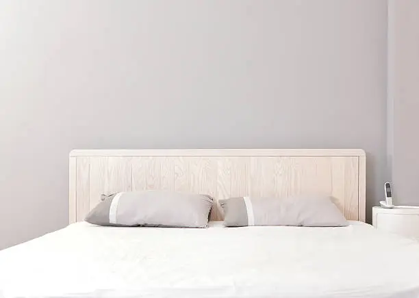 Photo of Modern bedroom styled with pale wood and greys