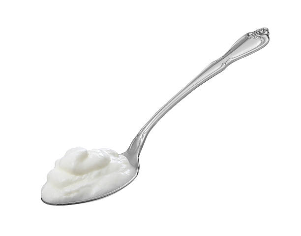 istock Spoonful of Yogurt isolated with a clipping path 166549369