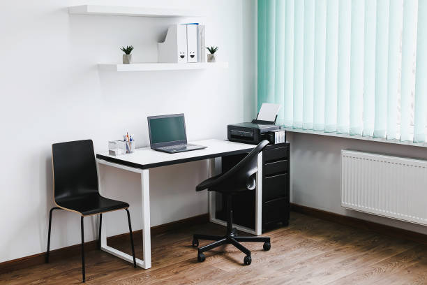 istock Workplace, laptop computer with blank empty white screen display monitor on desk. Mock up, copy space. Home office concept. 1665496433