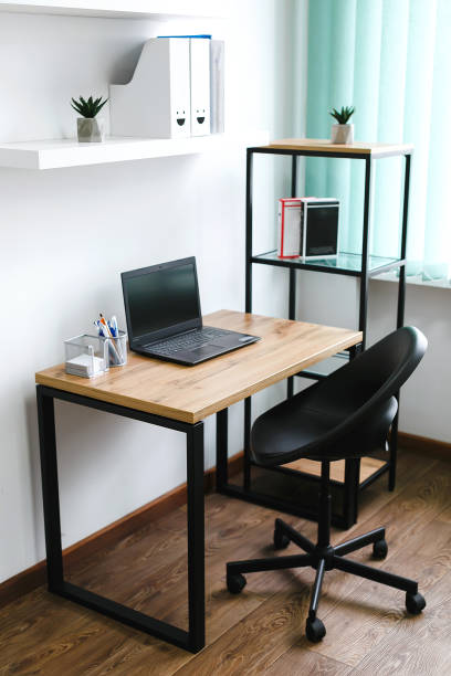 istock Workplace, laptop computer with blank empty white screen display monitor on desk. Mock up, copy space. Home office concept. 1665496941