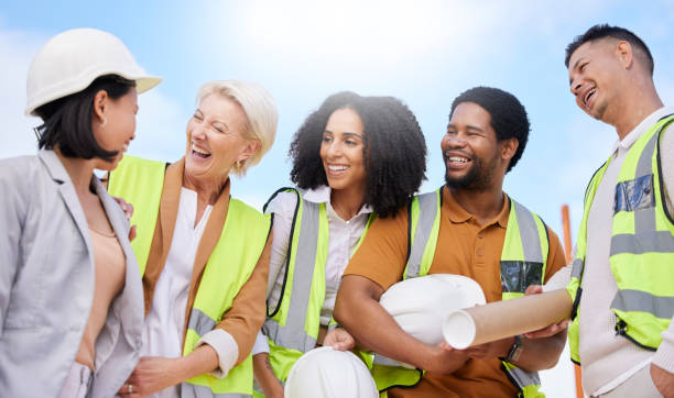 istock Engineering team, happy people and construction, architecture or planning project of outdoor development. Building contractor, industrial designer and funny discussion in group diversity and planning 1665503607