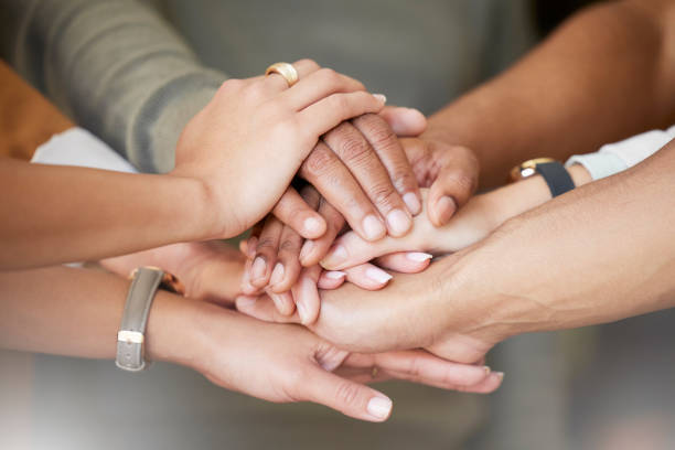 istock Office, teamwork and hands in huddle together for team building, collaboration and motivation at startup company. Work, goals and diversity, employees with business growth, development and support. 1665503957