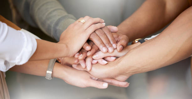 istock Office, teamwork and hands together in huddle for team building, collaboration and motivation at startup company. Work, goals and diversity, employees in business with growth, development and support 1665504055