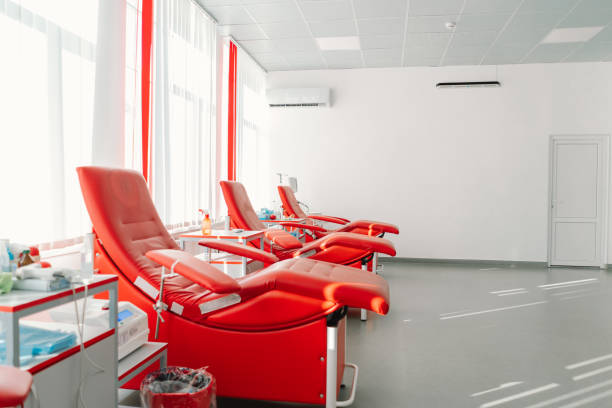 istock Red armchairs for sitting in donation center 1665505878
