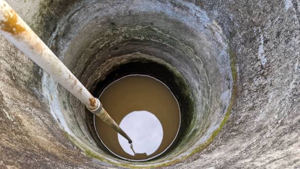 istock an old neglected round well with moss stains on the walls 1665535710