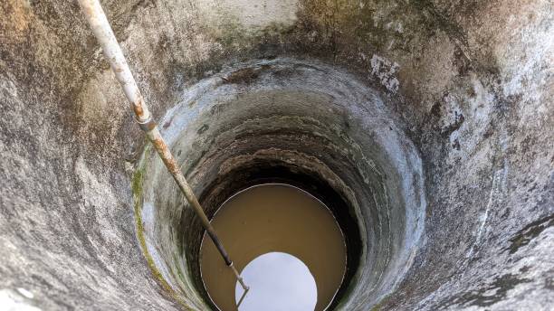 istock an old neglected round well with moss stains on the walls 1665541173