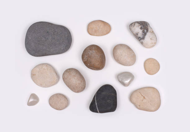 istock Stones on neutral gray copy space background. Flat lay, top view. 1665557624