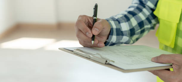 istock inspector or engineer is inspecting construction and quality assurance new house using a checklist. Engineers or architects or contactor work to build the house before handing it over to the homeowner 1665565188