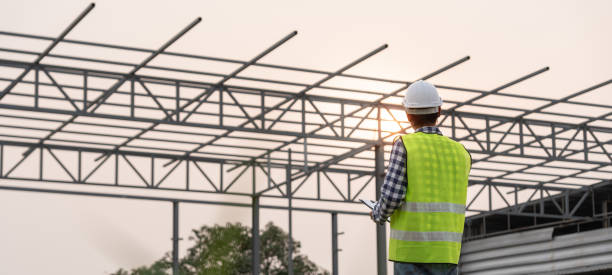 istock inspector or engineer is inspecting construction and quality assurance new factory using a checklist. Engineers or architects or contactor work to build the factory before handing it over to the homeowner 1665565206
