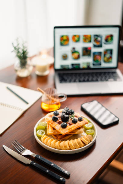 istock Waffles and mixed fruit on the desk 1665571652