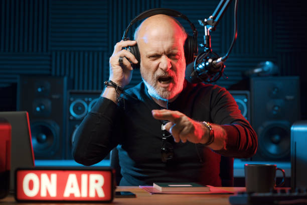 istock Confident radio DJ talking into the mic 1665610412
