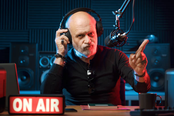 istock Radio host listening to music 1665611546